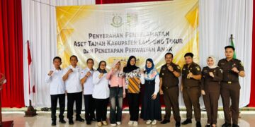 Pemerintah Kabupaten Lampung Timur bersama Kejaksaan Negeri Lampung Timur kembali memperkuat sinergi dalam mewujudkan tata kelola pemerintahan yang baik melalui penyerahan hasil penyelamatan aset milik Pemerintah Daerah Kabupaten Lampung Timur serta penyerahan penetapan perwalian anak